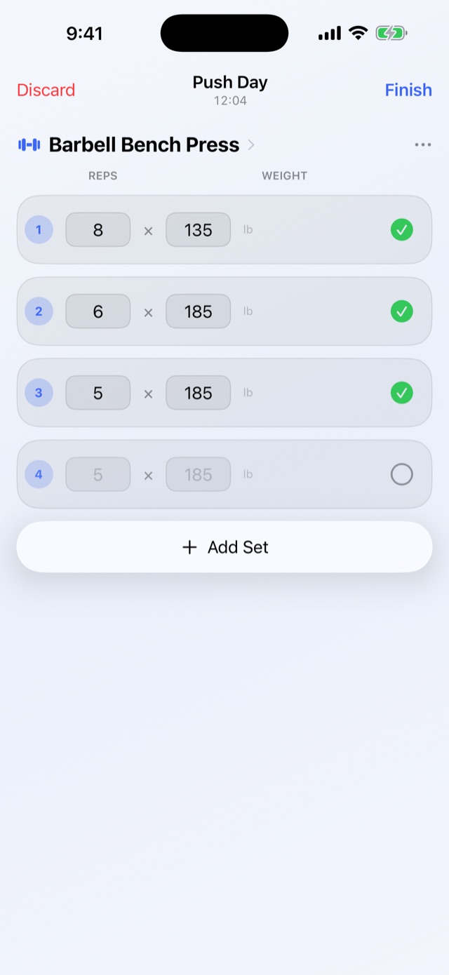 The Lifty app logging a Push Day workout — sets, reps and weight checked off one tap at a time.